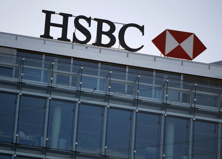 A HSBC logo is pictured at a Swiss branch of the bank, in Geneva February 9, 2015. British bank HSBC Holdings Plc admitted on February 8, 2015 failings by its Swiss subsidiary, in response to media reports it helped wealthy customers dodge taxes and conceal millions of dollars of assets. REUTERS/Pierre Albouy (SWITZERLAND - Tags: BUSINESS LOGO) - RTR4OTHK