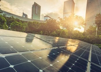 Roof top solar installation with shenzhen downtown skyline view as background,China.